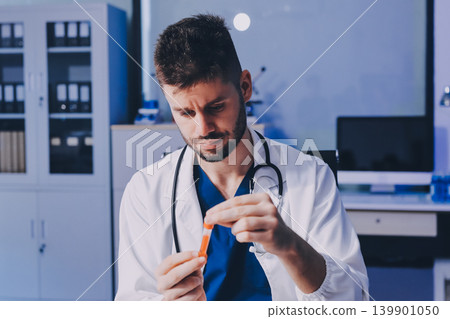 Attractive student of chemistry working in laboratory 139901050