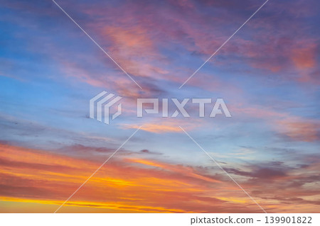 Vibrant Sunset Sky With Colorful Layered Clouds Vibrant Sunset Sky With Colorful Layered Clouds 139901822