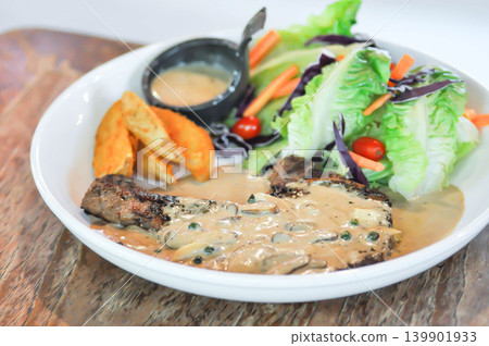 pork steak or grilled pork and salad or pork chop with fried potato and vegetable pork steak or grilled pork and salad or pork chop with fried potato and vegetable 139901933