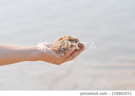 sand, holding sand or beach sand or sea sand or play sand sand, holding sand or beach sand or sea sand or play sand 139902051