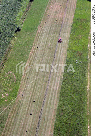 An aerial view of tractor working in a field in Sisljavic Croatia An aerial view of tractor working in a field in Sisljavic Croatia 139902059