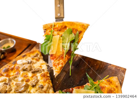 Top view of hand with pizza Pie Server Pizza Truffle and mushroom, pizza Rucola and parmesan, focus selective Top view of hand with pizza Pie Server Pizza Truffle and mushroom, pizza Rucola and parmesan, focus selective 139902464