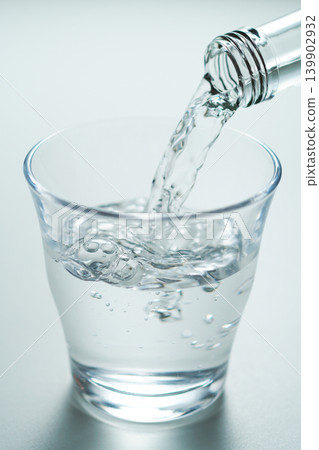 Pour bottled mineral water into a glass. No. 3 Pour bottled mineral water into a glass. No. 3 139902932