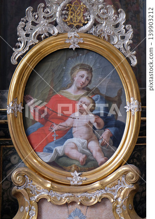 Virgin Mary with baby Jesus, altarpiece in the monastery church of St. John in Ursberg, Germany Virgin Mary with baby Jesus, altarpiece in the monastery church of St. John in Ursberg, Germany 139903212