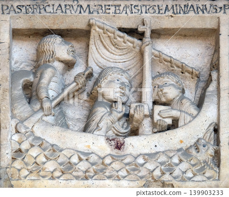 Scenes from the life of St. Geminianus : San Geminianus crosses the sea to free the daughter of Byzantine emperor Jovian, from the devil, bass relief by Wiligelmo, Modena Cathedral, Italy Scenes from the life of St. Geminianus : San Geminianus crosses the sea to free the daughter of Byzantine emperor Jovian, from the devil, bass relief by Wiligelmo, Modena Cathedral, Italy 139903233