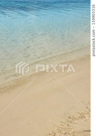 Beautiful beach scenery of Ishigaki Island, Okinawa, with its crystal-clear waters and pristine white sand. Beautiful beach scenery of Ishigaki Island, Okinawa, with its crystal-clear waters and pristine white sand. 139903316