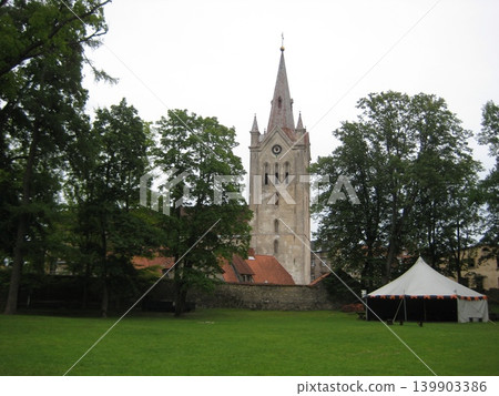 St. John's Church, nestled among the trees in the ancient Latvian city of Cesis. St. John's Church, nestled among the trees in the ancient Latvian city of Cesis. 139903386