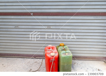 Kerosene can in front of the shutter Kerosene can in front of the shutter 139903709