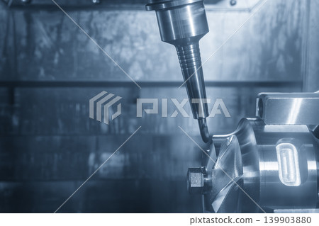 High-precision automotive parts production process using a 5-axis CNC milling machine and ball nose end mill tool in a blue-toned scene with dramatic lighting effects. High-precision automotive parts production process using a 5-axis CNC milling machine and ball nose end mill tool in a blue-toned scene with dramatic lighting effects. 139903880