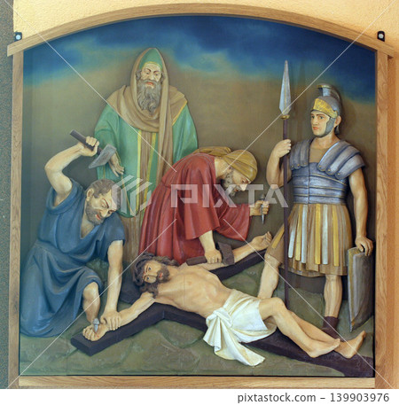 11th Stations of the Cross, Crucifixion: Jesus is nailed to the cross, Church of the Blessed Aloysius Stepinac in Budasevo, Croatia 139903976