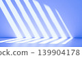 A room with blue walls and sunlight streaming in. Window shadows. A space for branding and presentations. 139904178