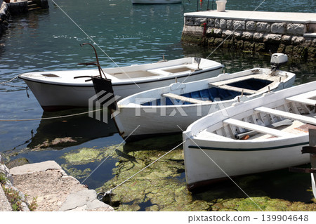 Old white boat in Perast, Montenegro Old white boat in Perast, Montenegro 139904648