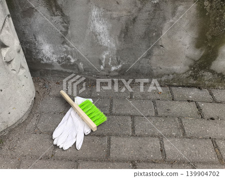 Cleaning brush and work glove on concrete Cleaning brush and work glove on concrete 139904702