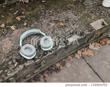 Mint Green Wireless Headphones on Textured Concrete Mint Green Wireless Headphones on Textured Concrete 139904705