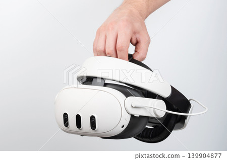 Hand holding vr headset Hand holding vr headset 139904877