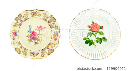 Two exquisite porcelain side plates isolated on a clean white background. 139904951