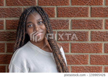 woman, young, african, black, portrait, face, smile, braids, braided, hair, brick, wall, red, background, urban, casual, lifestyle, headshot, closeup, beauty, beautiful, pretty, diversity, diverse, woman, young, african, black, portrait, face, smile, braids, braided, hair, brick, wall, red, background, urban, casual, lifestyle, headshot, closeup, beauty, beautiful, pretty, diversity, diverse, 139905426