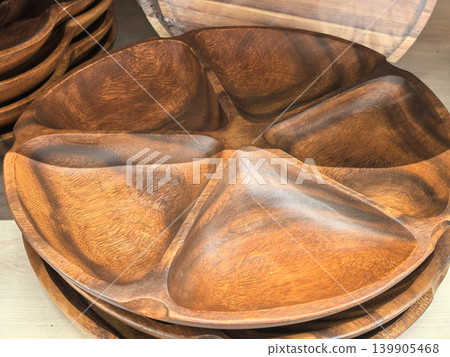 Handcrafted acacia wood divided serving tray with five compartments closeup 139905468