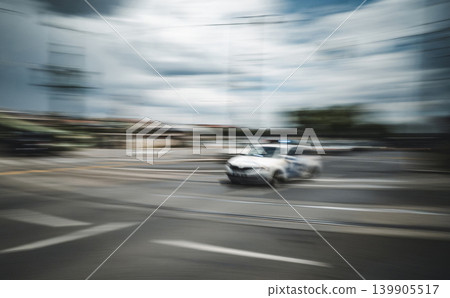 Police Car Moving Fast Along Urban Street In City Center Police Car Moving Fast Along Urban Street In City Center 139905517