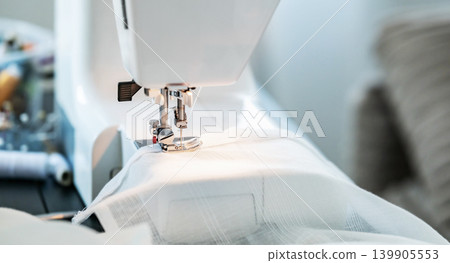 Close View of Sewing Machine Working on Fabric Close View of Sewing Machine Working on Fabric 139905553