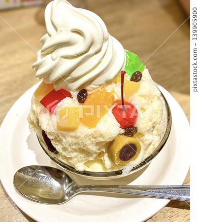 Kagoshima's famous "Shirokuma" shaved ice, topped with soft serve ice cream and plenty of fruit. 139905900