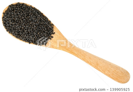 Top view of a wooden spoon overflowing with black basil seeds isolated. This image represents healthy food ingredients, superfoods, and holistic wellness concepts. Top view of a wooden spoon overflowing with black basil seeds isolated. This image represents healthy food ingredients, superfoods, and holistic wellness concepts. 139905925