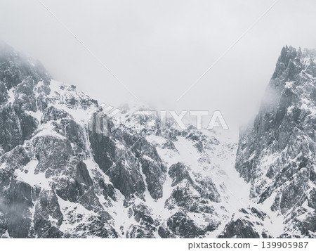 A mountain peak covered with snow. A mountain peak covered with snow. 139905987