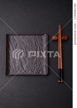 Empty slate board with wooden chopsticks for Asian food. Empty slate board Empty slate board with wooden chopsticks for Asian food. Empty slate board 139906289