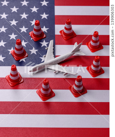A mock up of airplane with no fly signs on a US flag as a concept for a flight ban A mock up of airplane with no fly signs on a US flag as a concept for a flight ban 139906303