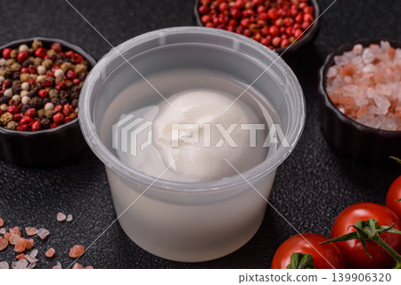 Fresh white burrata cheese with tomatoes for a salad. Burrata cheese Fresh white burrata cheese with tomatoes for a salad. Burrata cheese 139906320