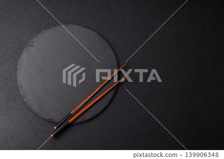 Empty slate board with wooden chopsticks for Asian food. Empty slate board Empty slate board with wooden chopsticks for Asian food. Empty slate board 139906348
