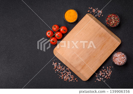 An empty wooden cutting board, kitchen utensils for food preparation. An empty cutting board 139906356