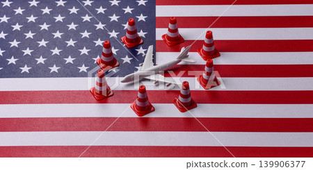 A mock up of airplane with no fly signs on a US flag as a concept for a flight ban A mock up of airplane with no fly signs on a US flag as a concept for a flight ban 139906377