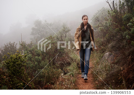 Portrait, travel and woman in nature for hiking, wellness or morning walk outdoor in winter. Path, trekking and female person in a forest for fresh air, camping or adventure, journey or campsite fun 139906553