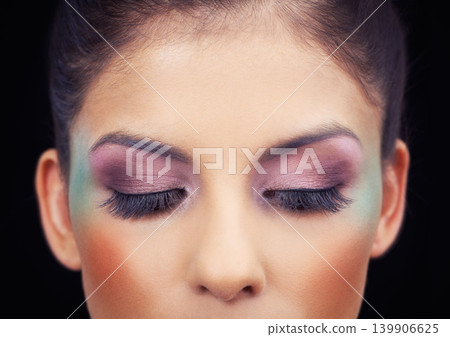Colorful, makeup and creative eyeshadow with woman in studio and black background with beauty. Cosmetics, creativity and model with unique rainbow aesthetic on face to glow or shine with confidence Colorful, makeup and creative eyeshadow with woman in studio and black background with beauty. Cosmetics, creativity and model with unique rainbow aesthetic on face to glow or shine with confidence 139906625