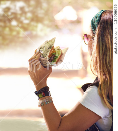 Hand, fast food and woman eating burger closeup outdoor for hunger, takeaway or craving in summer. Hamburger, lunch or snack with hungry young person holding a fresh beef bun for cuisine or meal Hand, fast food and woman eating burger closeup outdoor for hunger, takeaway or craving in summer. Hamburger, lunch or snack with hungry young person holding a fresh beef bun for cuisine or meal 139906636