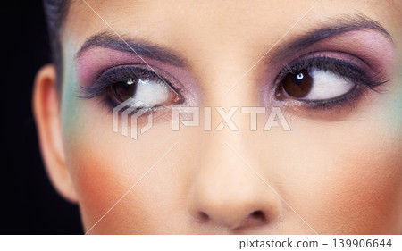 Eyes, makeup and woman with colorful and creative beauty in studio and black background. Unique, cosmetics and model thinking with rainbow aesthetic on face to glow or shine with bold confidence 139906644