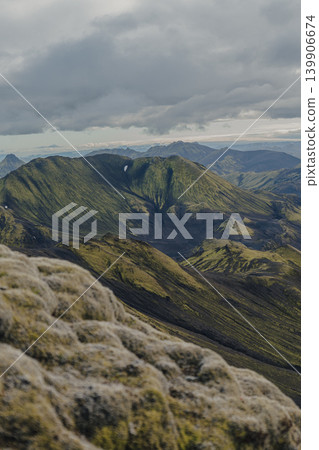 Moss Covered Mountains and Valleys in Iceland Under Cloudy Sky Moss Covered Mountains and Valleys in Iceland Under Cloudy Sky 139906674