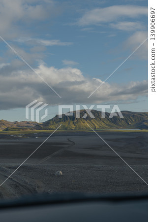 Mountain and Rocky Plains in Eastern Iceland Under Partly Cloudy Sky 139906697