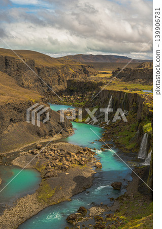 Turquoise River Winding Through Rugged Canyon in Iceland Turquoise River Winding Through Rugged Canyon in Iceland 139906781