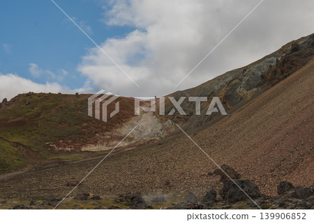 Rugged Icelandic Hillside with Volcanic Terrain and Small Figure Rugged Icelandic Hillside with Volcanic Terrain and Small Figure 139906852