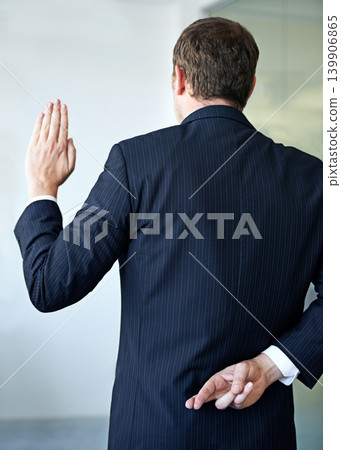 Businessman, back and fingers crossed with luck of liar for hope, confidential or secret at office. Rear view of man or business employee hiding hand in conspiracy, lie or swear for truth or honesty 139906865