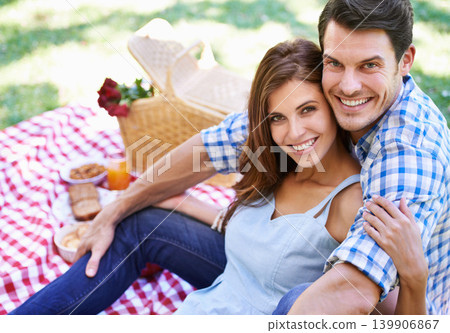 Portrait, love and happy couple with picnic in the park to celebrate valentines day vacation. Face, smile and man with woman hugging for affection and bonding with food and flowers on nature holiday 139906867
