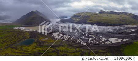 Aerial View of Icelandic Glacier with Moss Covered Mountains Aerial View of Icelandic Glacier with Moss Covered Mountains 139906907