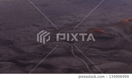 Aerial View of Volcanic Landscape with Winding Road in Iceland 139906999