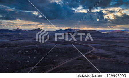 Aerial View of Volcanic Landscape with Roads and Distant Mountains Aerial View of Volcanic Landscape with Roads and Distant Mountains 139907003