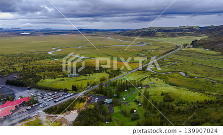 Aerial View of Icelandic Landscape with Rivers and Red Roof Building Aerial View of Icelandic Landscape with Rivers and Red Roof Building 139907024