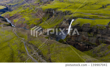 Aerial View of Icelandic Waterfall Cascading into a Deep Canyon 139907041