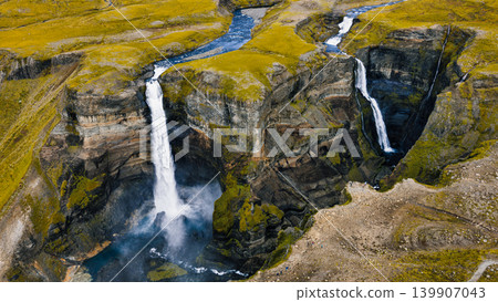 Aerial View of Twin Waterfalls Cascading into a Canyon in Iceland Aerial View of Twin Waterfalls Cascading into a Canyon in Iceland 139907043