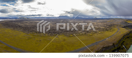 Aerial View of Volcanic Landscape with Road and River in Iceland Aerial View of Volcanic Landscape with Road and River in Iceland 139907075
